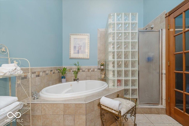 6363 Harmonridge Ct, Indianapolis, IN 46278 - full bathroom with tile patterned flooring, a shower stall, and a garden tub