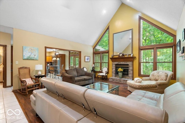 6363 Harmonridge Ct, Indianapolis, IN 46278 - living area with high vaulted ceiling, a fireplace, and wood finished floors