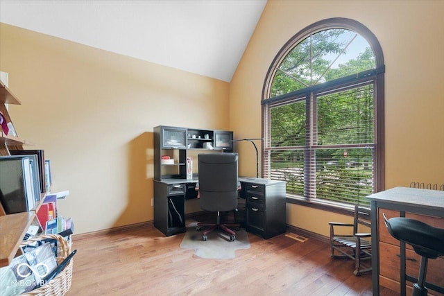 6363 Harmonridge Ct, Indianapolis, IN 46278 - home office featuring healthy amount of natural light, light wood-style flooring, high vaulted ceiling, and baseboards