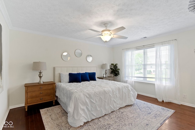 3014 Saddlehorn Dr, Carmel, IN 46033 - bedroom featuring dark wood-style flooring, baseboards, a textured ceiling, crown molding, and ceiling fan