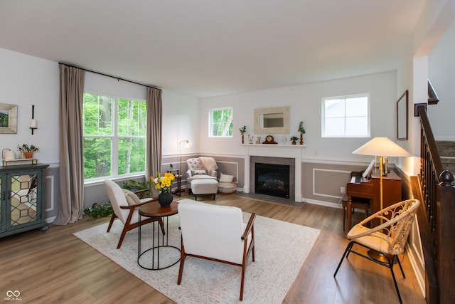 527 Macintosh Ln, Danville, IN 46122 - living room with wood finished floors, a fireplace with flush hearth, and wainscoting