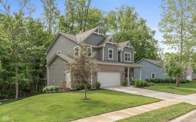 527 Macintosh Ln, Danville, IN 46122 - craftsman house with board and batten siding, concrete driveway, a garage, brick siding, and a front yard