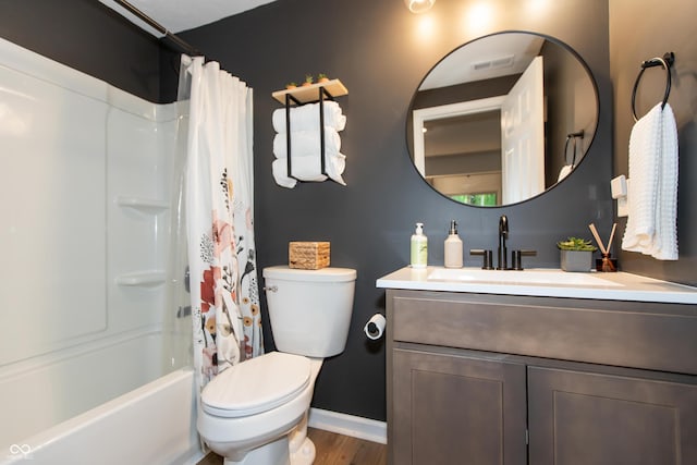 527 Macintosh Ln, Danville, IN 46122 - bathroom featuring vanity, toilet, baseboards, wood finished floors, and shower / tub combo with curtain