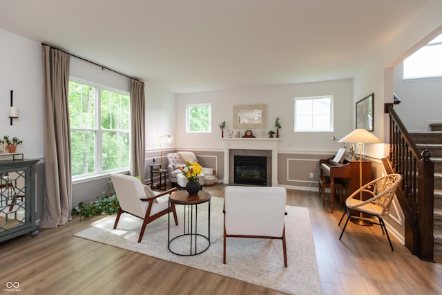 527 Macintosh Ln, Danville, IN 46122 - living area with stairs, wood finished floors, plenty of natural light, and a glass covered fireplace