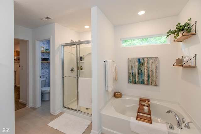 527 Macintosh Ln, Danville, IN 46122 - full bathroom with a shower stall, a bath, toilet, and recessed lighting
