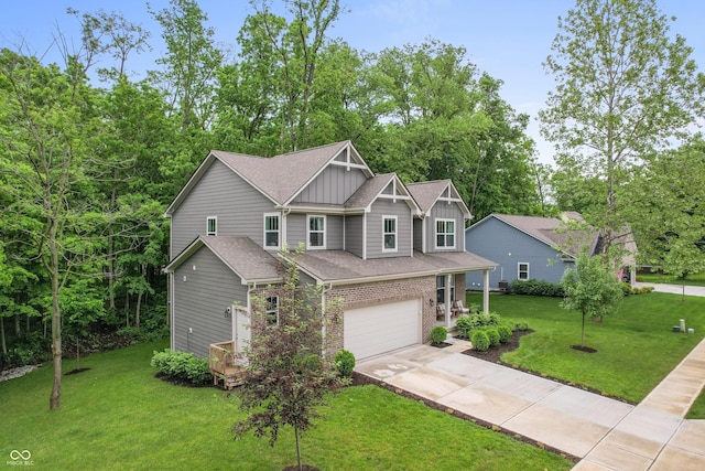 527 Macintosh Ln, Danville, IN 46122 - craftsman-style home with board and batten siding, an attached garage, concrete driveway, brick siding, and a front yard