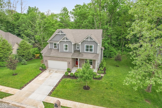 527 Macintosh Ln, Danville, IN 46122 - view of front of property with board and batten siding, driveway, covered porch, a garage, and a front lawn