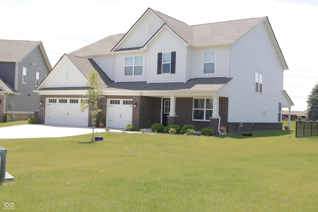 9640 Katana Cir, Fishers, IN 46040 - craftsman-style home with driveway, a front lawn, and brick siding