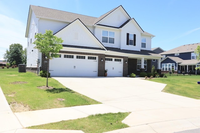 9640 Katana Cir, Fishers, IN 46040 - craftsman-style home with a garage, concrete driveway, a front lawn, central air condition unit, and brick siding
