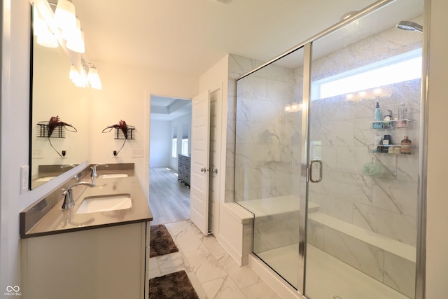 9640 Katana Cir, Fishers, IN 46040 - full bath featuring marble finish flooring, healthy amount of natural light, double vanity, and a marble finish shower
