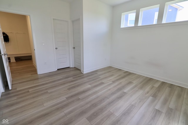 9640 Katana Cir, Fishers, IN 46040 - unfurnished bedroom with light wood-type flooring and baseboards