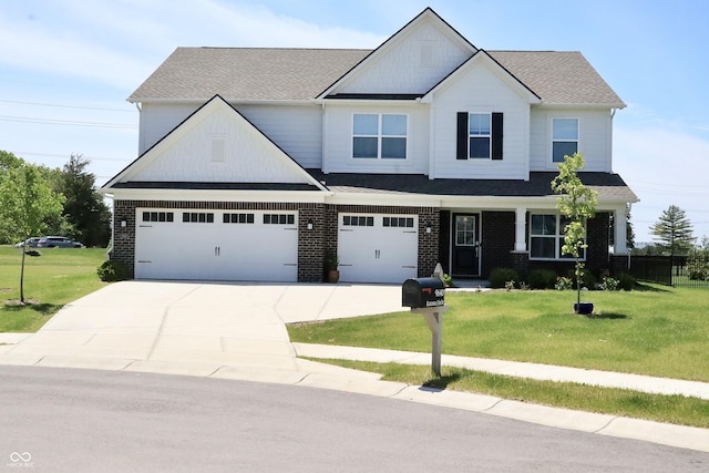 9640 Katana Cir, Fishers, IN 46040 - craftsman-style home with concrete driveway, a front lawn, and brick siding