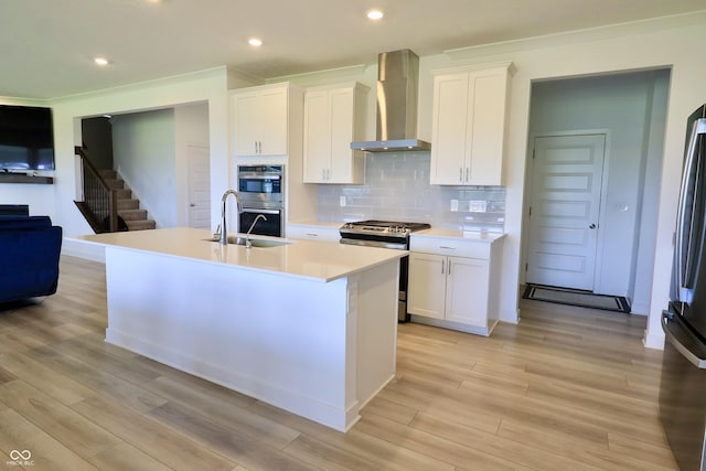 9640 Katana Cir, Fishers, IN 46040 - kitchen with wall chimney range hood, appliances with stainless steel finishes, a sink, light countertops, and white cabinetry