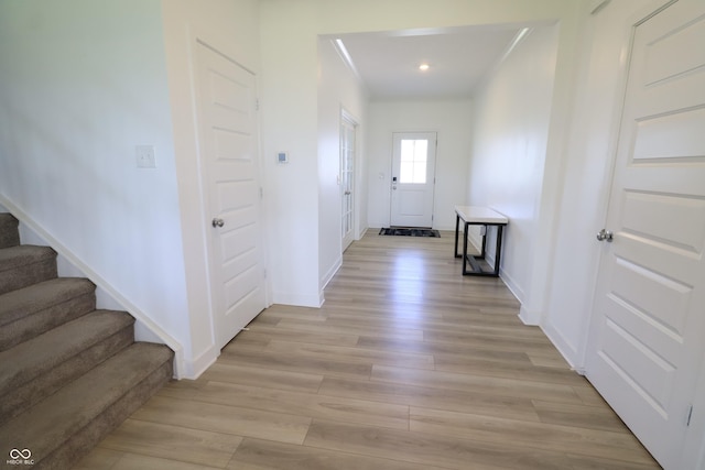9640 Katana Cir, Fishers, IN 46040 - hallway featuring light wood-style flooring, stairway, baseboards, and recessed lighting