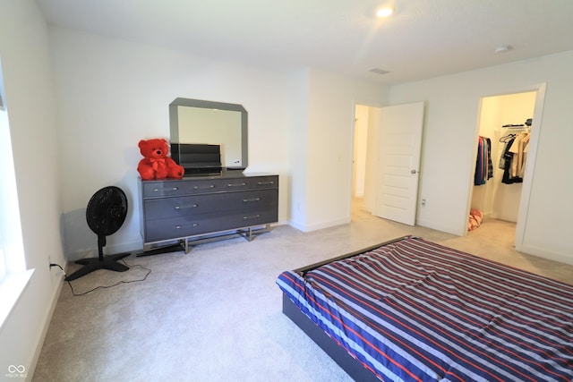 9640 Katana Cir, Fishers, IN 46040 - bedroom with light carpet, a spacious closet, and baseboards
