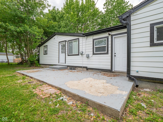 1141 Temperance Ave, Indianapolis, IN 46203 - rear view of house featuring a patio area and a lawn