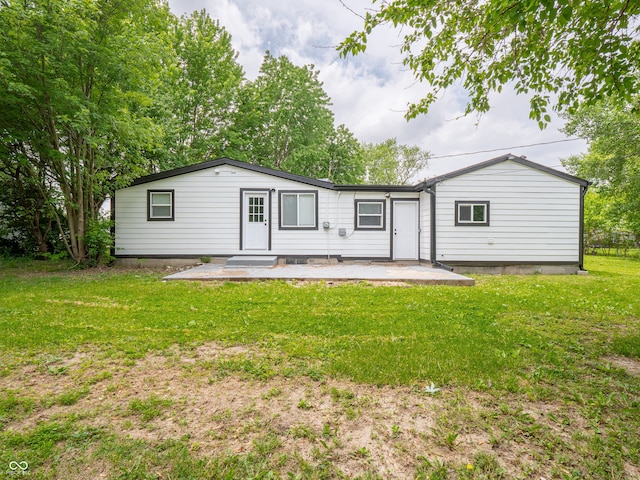 1141 Temperance Ave, Indianapolis, IN 46203 - back of property featuring a yard and a patio