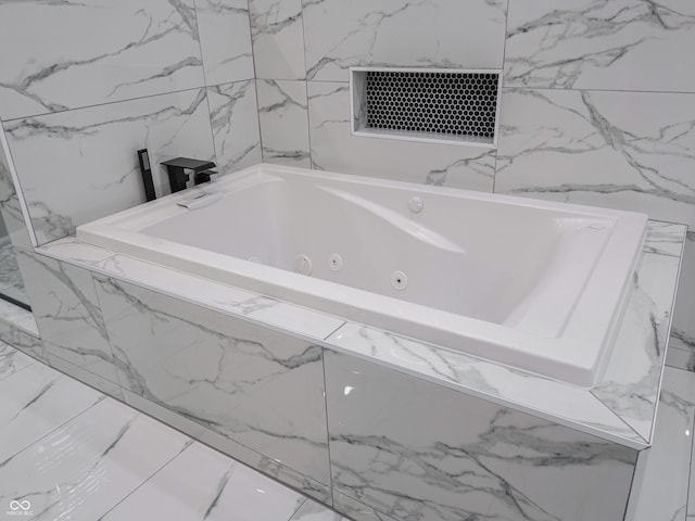 1141 Temperance Ave, Indianapolis, IN 46203 - bathroom featuring a jetted tub and marble finish floors