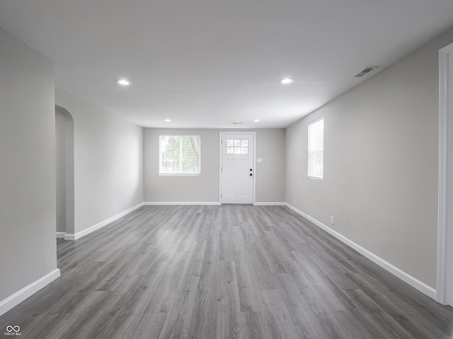 1141 Temperance Ave, Indianapolis, IN 46203 - entrance foyer featuring recessed lighting, arched walkways, baseboards, and wood finished floors