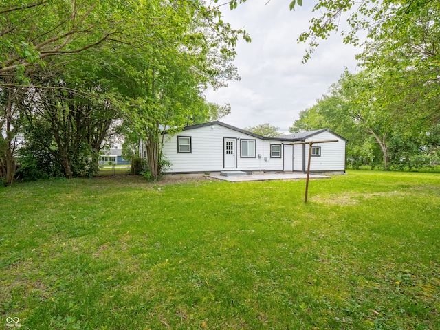 1141 Temperance Ave, Indianapolis, IN 46203 - rear view of property with a patio and a lawn
