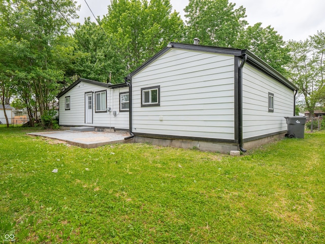 1141 Temperance Ave, Indianapolis, IN 46203 - back of property with a patio area and a lawn