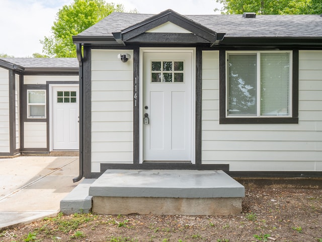 1141 Temperance Ave, Indianapolis, IN 46203 - entrance to property with a shingled roof