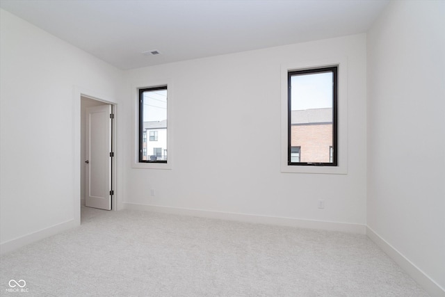 1822 Central Ave, Indianapolis, IN 46202 - carpeted spare room featuring baseboards