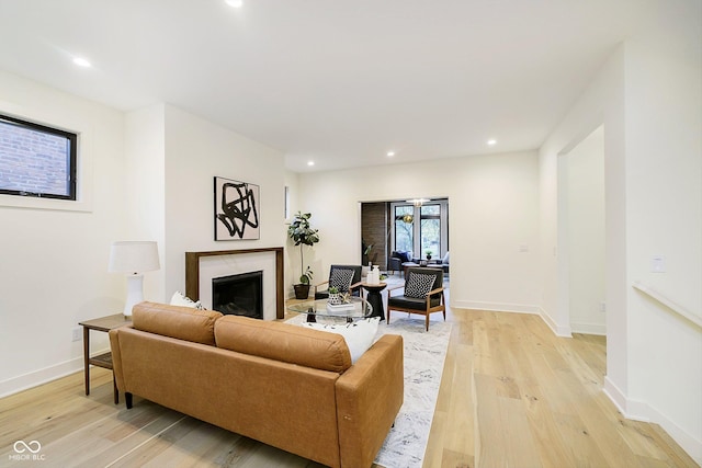 1822 Central Ave, Indianapolis, IN 46202 - living area with a fireplace, light wood-style floors, baseboards, and recessed lighting