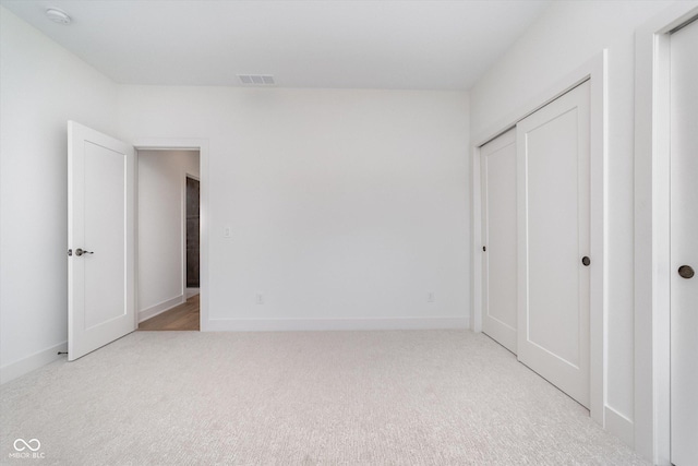 1822 Central Ave, Indianapolis, IN 46202 - unfurnished bedroom featuring carpet, baseboards, and a closet