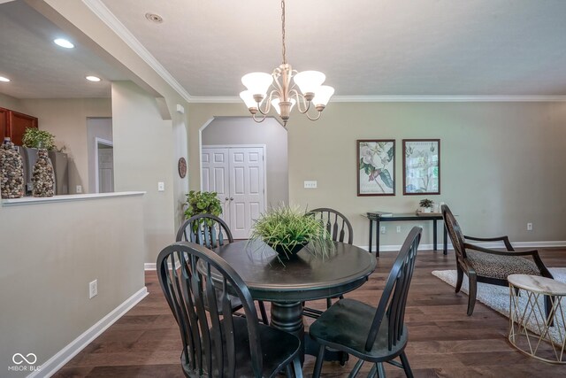 9743 Herons Cv, Carmel, IN 46280 - dining room featuring baseboards, dark wood-style floors, crown molding, a chandelier, and recessed lighting