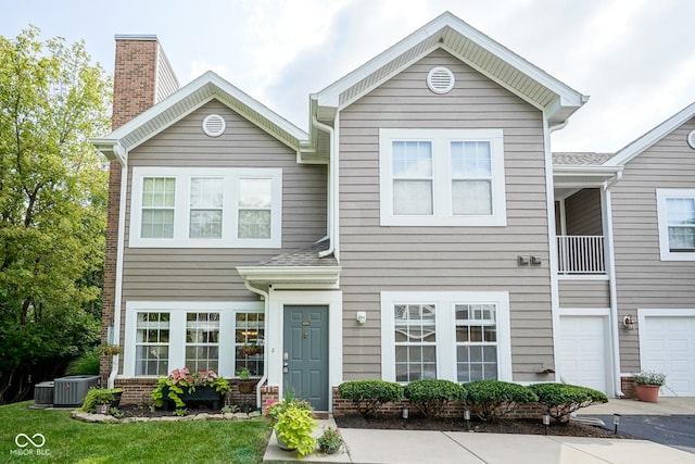9743 Herons Cv, Carmel, IN 46280 - multi unit property featuring a chimney, central AC, and driveway