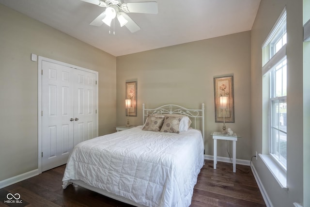9743 Herons Cv, Carmel, IN 46280 - bedroom featuring dark wood-style flooring, baseboards, and a closet