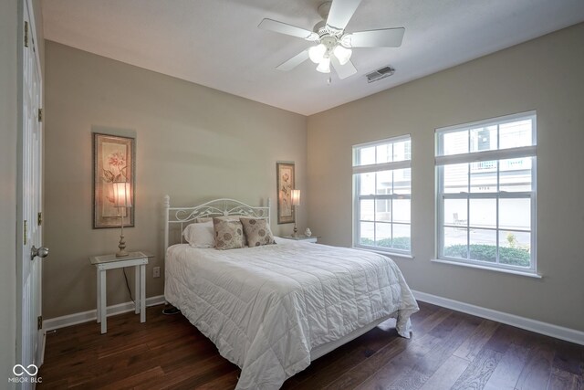 9743 Herons Cv, Carmel, IN 46280 - bedroom with dark wood-style floors, baseboards, and ceiling fan