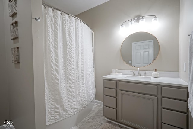 9743 Herons Cv, Carmel, IN 46280 - bathroom featuring marble finish flooring, vanity, and shower / tub combo
