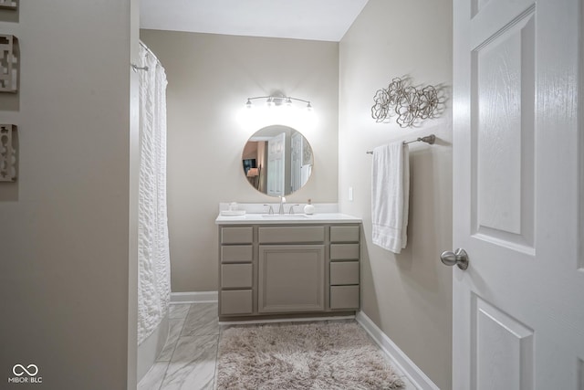 9743 Herons Cv, Carmel, IN 46280 - full bathroom with vanity, marble look tile flooring, baseboards, and a shower with shower curtain
