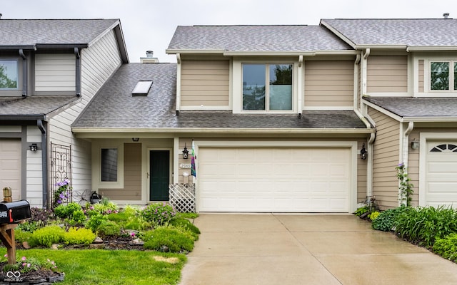 2949 River Bay Dr N, Indianapolis, IN 46240 - view of property featuring driveway, a shingled roof, and an attached garage