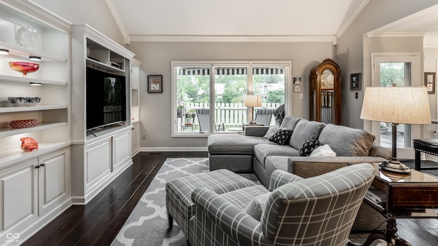 2949 River Bay Dr N, Indianapolis, IN 46240 - living area featuring dark wood-style floors, ornamental molding, healthy amount of natural light, and baseboards