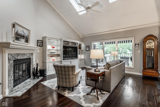 2949 River Bay Dr N, Indianapolis, IN 46240 - living room with a ceiling fan, dark wood-type flooring, high vaulted ceiling, a skylight, and crown molding