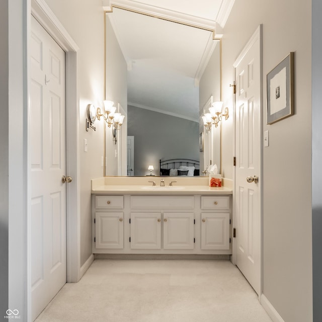 2949 River Bay Dr N, Indianapolis, IN 46240 - bathroom featuring ornamental molding, vanity, and baseboards
