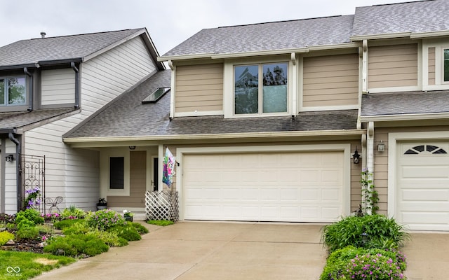 2949 River Bay Dr N, Indianapolis, IN 46240 - townhome / multi-family property featuring roof with shingles, concrete driveway, and a garage