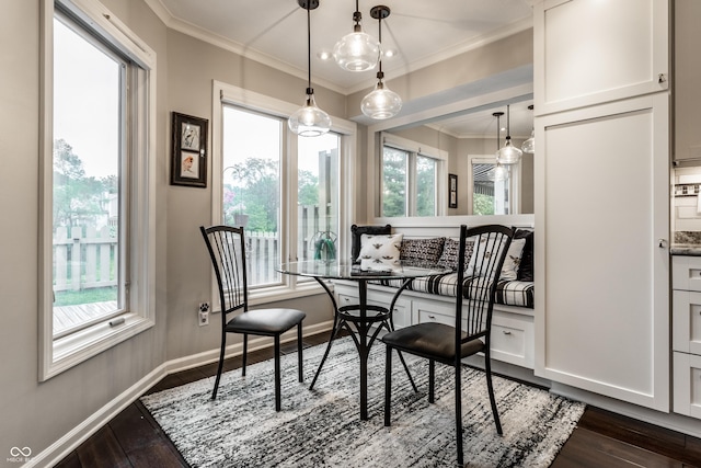 2949 River Bay Dr N, Indianapolis, IN 46240 - dining room with breakfast area, ornamental molding, dark wood-style flooring, and baseboards
