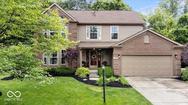 11956 Glen Cove Dr, Indianapolis, IN 46236 - traditional-style house featuring concrete driveway, brick siding, a front yard, and an attached garage