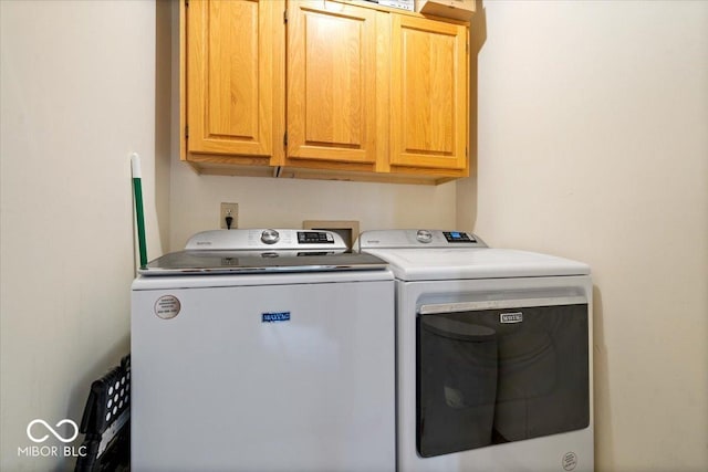 11956 Glen Cove Dr, Indianapolis, IN 46236 - laundry area with cabinet space and washing machine and dryer
