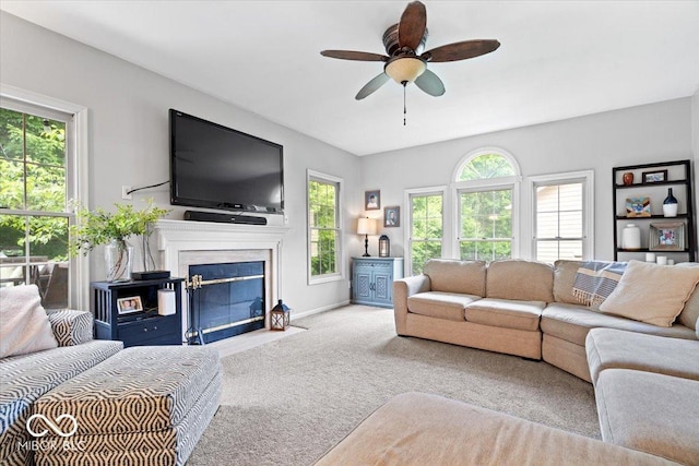 11956 Glen Cove Dr, Indianapolis, IN 46236 - living area with carpet flooring, ceiling fan, a fireplace, and baseboards