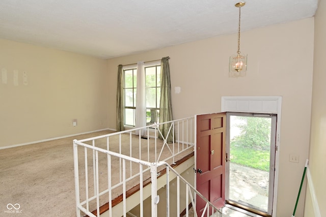 3668 Chatsbee Ct, Indianapolis, IN 46224 - carpeted foyer featuring a chandelier and baseboards