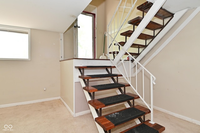 3668 Chatsbee Ct, Indianapolis, IN 46224 - stairway featuring plenty of natural light, baseboards, and carpet flooring
