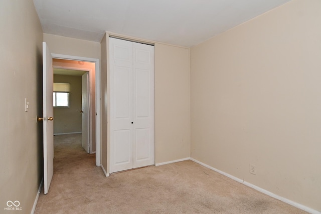 3668 Chatsbee Ct, Indianapolis, IN 46224 - unfurnished bedroom with light carpet, a closet, and baseboards