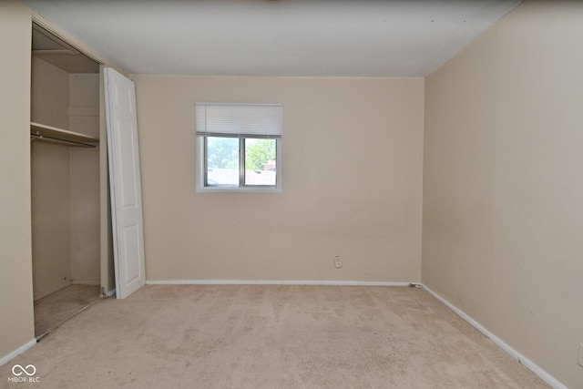 3668 Chatsbee Ct, Indianapolis, IN 46224 - unfurnished bedroom featuring light carpet, baseboards, and a closet