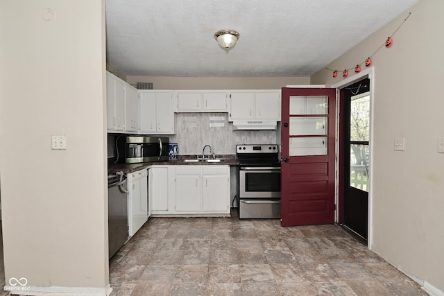 3668 Chatsbee Ct, Indianapolis, IN 46224 - kitchen featuring stainless steel appliances, a sink, extractor fan, dark countertops, and white cabinetry