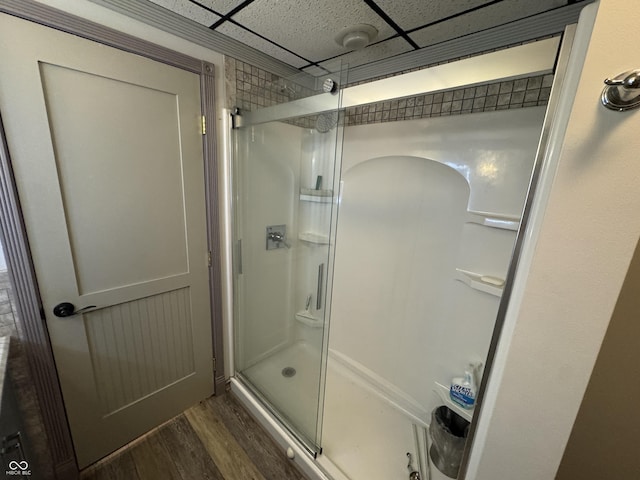 16952 Bookout Rd, Hagerstown, IN 47346 - bathroom with a shower stall, wood finished floors, and a paneled ceiling